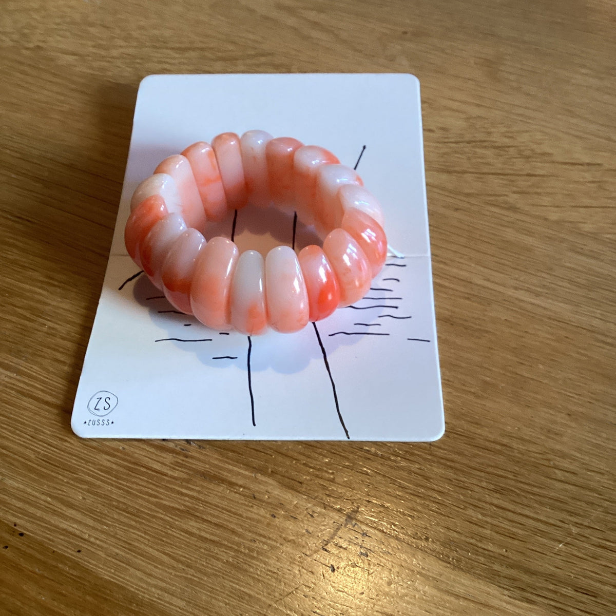 Zusss brede armband gevlamd oranje