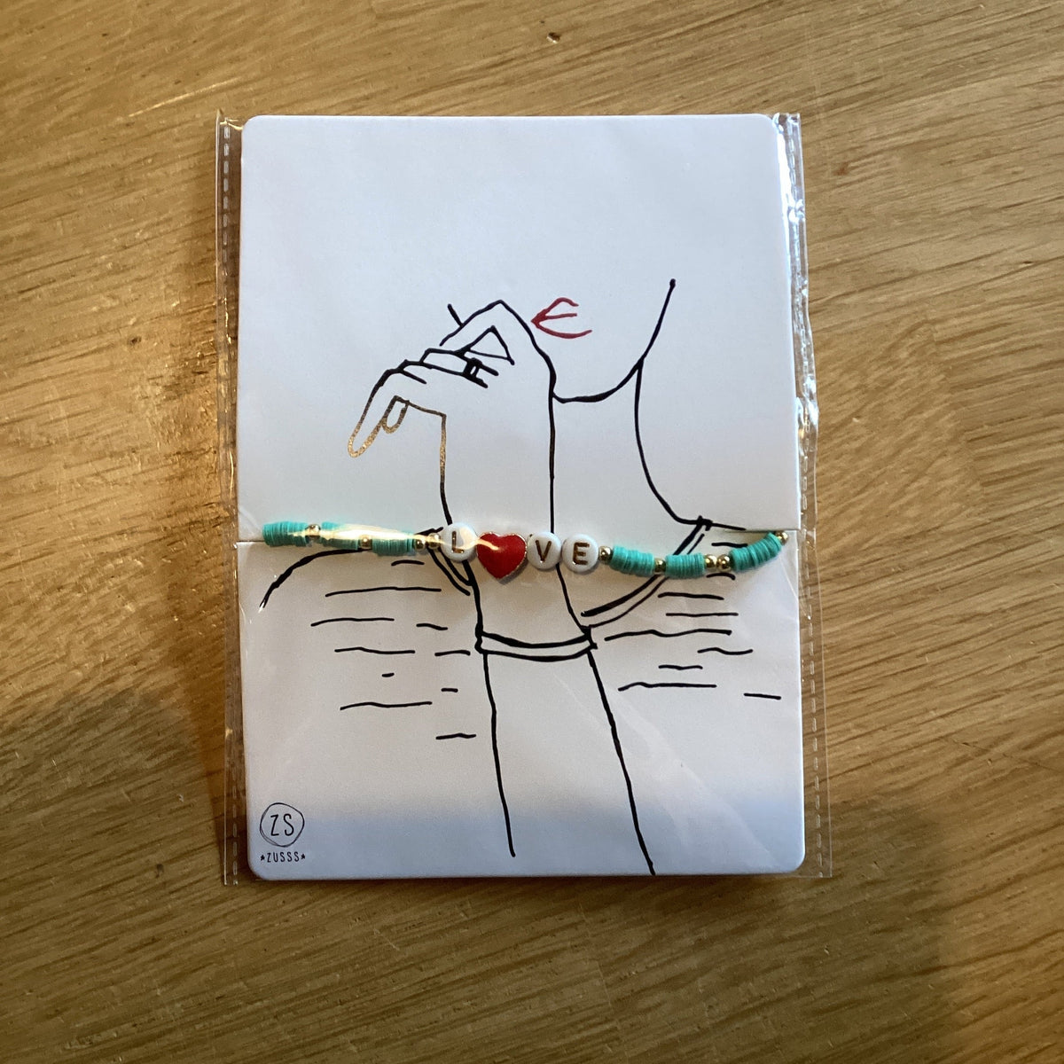 Zusss kralenarmband met tekst love