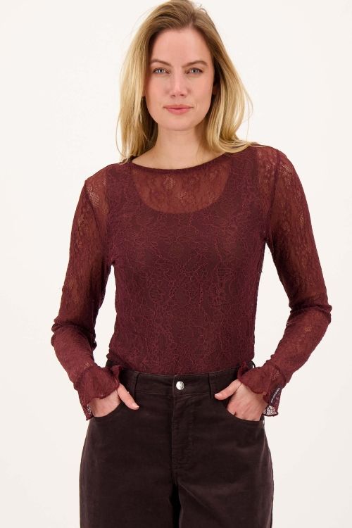 Top van stretch kant met ruffle mouwen .